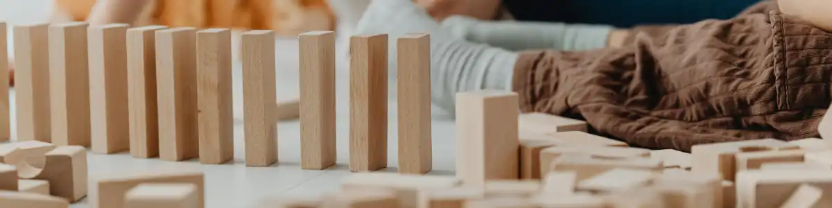 Kids playing with lined up blocks